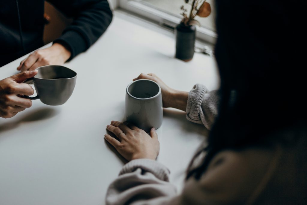 Australian couple having a supportive conversation about recovery in a counselling setting